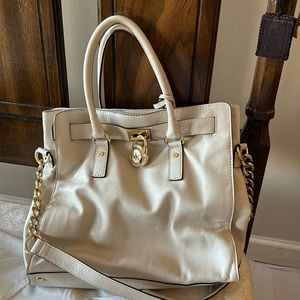 Michael Kors bag.  Off whitewith gold chain, lock and key. Never worn